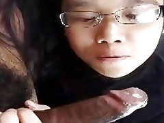 Asian girl sucks BBC and Swallows his cum